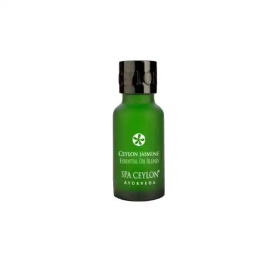 Green glass bottle of Ceylon Jasmine essential oil blend with black cap, white background
