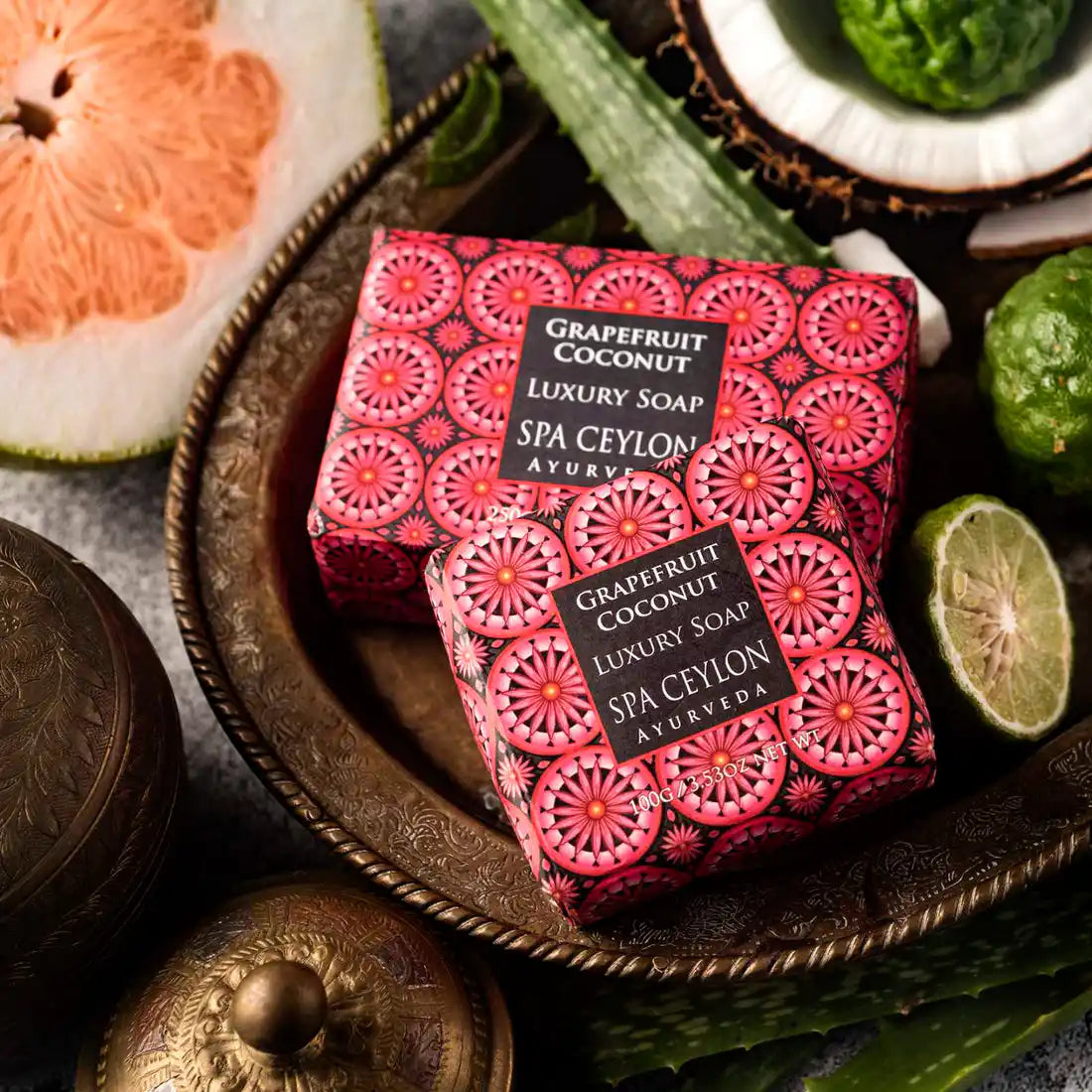 Grapefruit coconut luxury soap bars with decorative packaging and fresh fruit accents