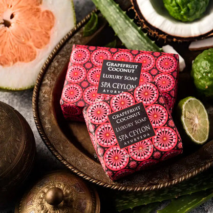 Grapefruit coconut luxury soap bars with decorative packaging and fresh fruit accents