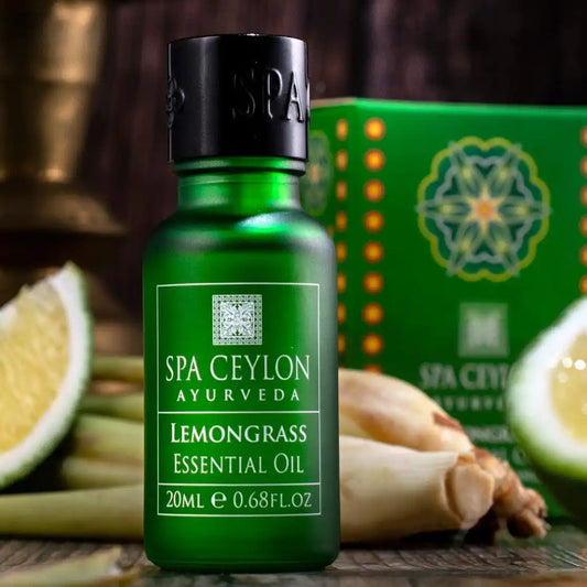 Lemongrass essential oil 20ml green bottle with fresh lemongrass and lime slices