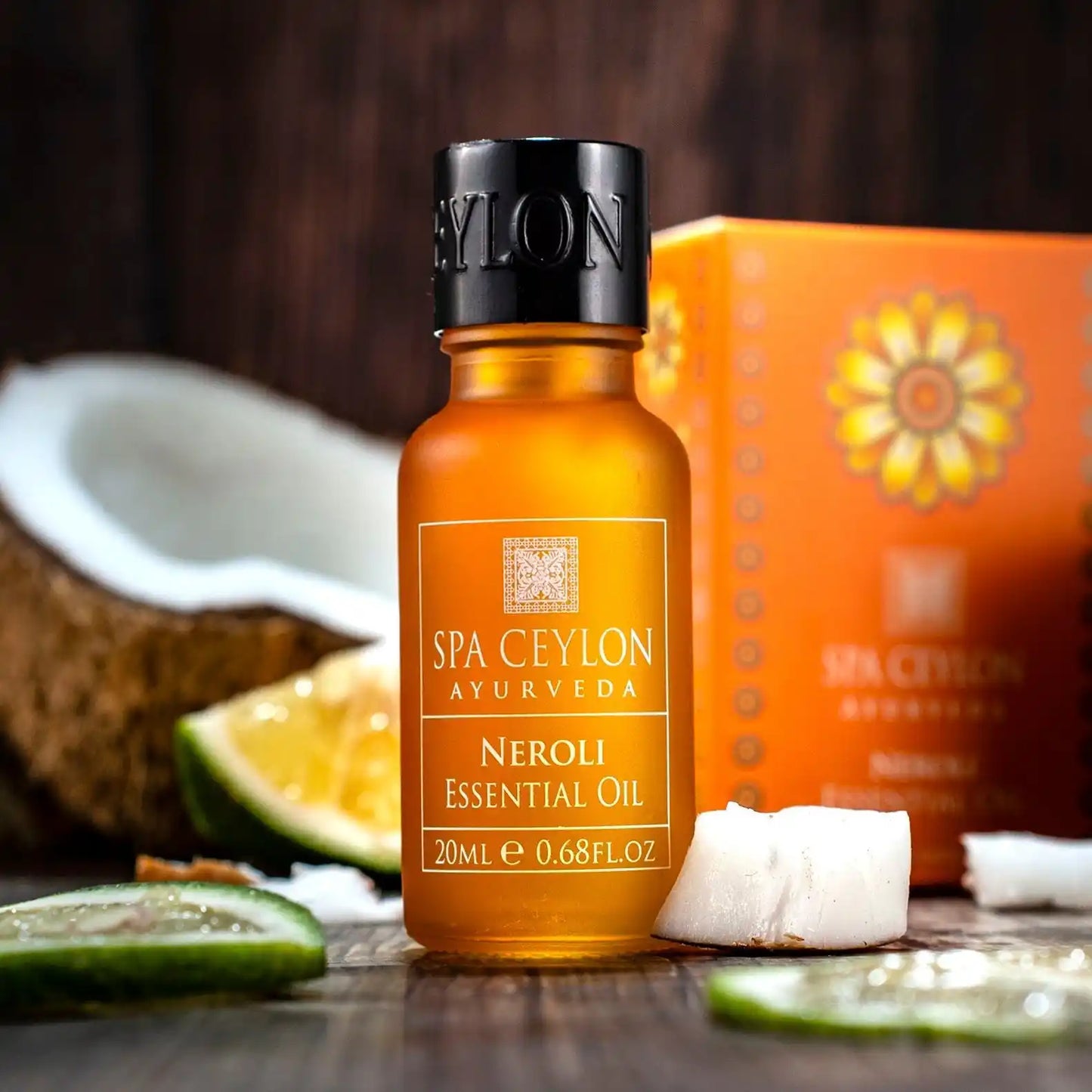 Neroli essential oil 20ml bottle with coconut and citrus slices on wooden table