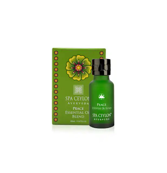 Green bottle of Peace essential oil blend with matching box, featuring floral design and gold accents
